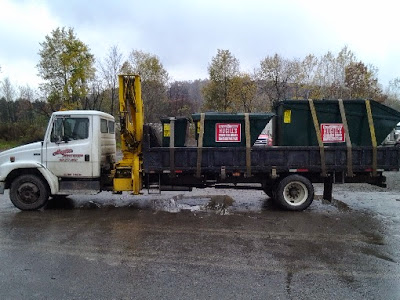 dumpster delivery truck